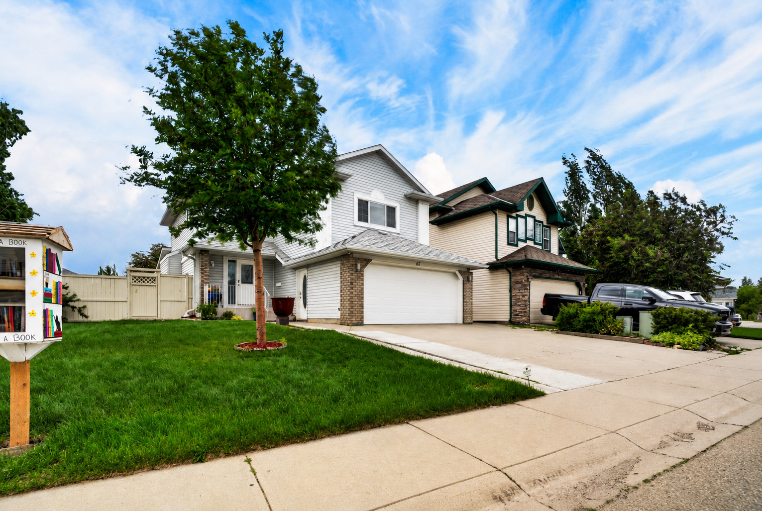 Angled exterior view showing the front lawn and driveway